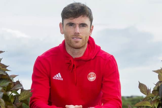 Greg Tansey, after making his debut for Aberdeen in a pre-season friendly at St Johnstone, does not want to see his new club follow the Perth team out of Europe. Photographs: SNS