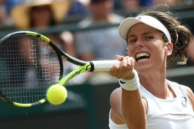 Johanna Konta returns against Greece's Maria Sakkari during their third round match. Picture: Oli Scarff/AFP/Getty Images