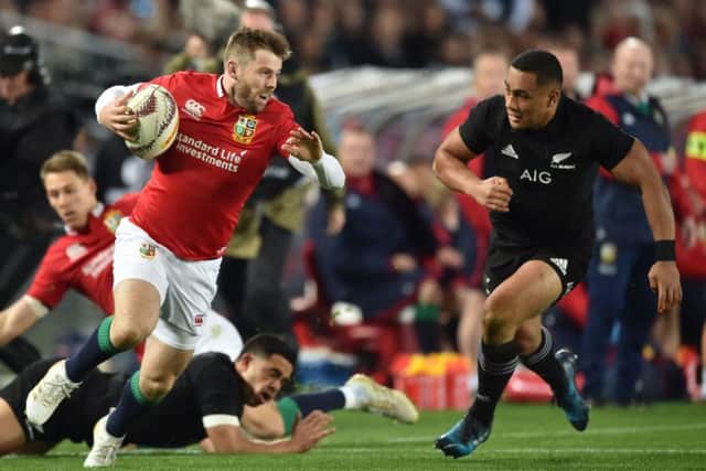 British and Irish Lions left wing Elliot Daly is tackled by New Zealand's inside centre Ngani Laumape. Picture: PETER PARKS/AFP/Getty Images