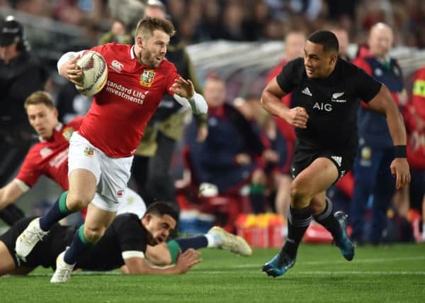 British and Irish Lions left wing Elliot Daly is tackled by New Zealand's inside centre Ngani Laumape. Picture: PETER PARKS/AFP/Getty Images
