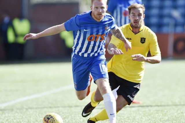 Kilmarnock trialist Chris Burke and Livingston's Scott Pittman. Picture: Rob Casey/SNS