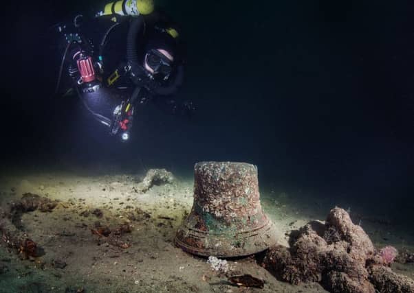A diver looking at the bell on the wreck of the HMS Vanguard in Scapa Flow. Picture: PA