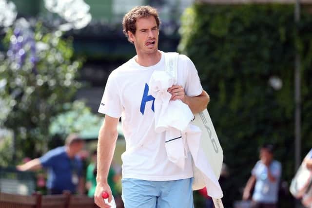 Andy Murray arrives for training at Wimbledon.