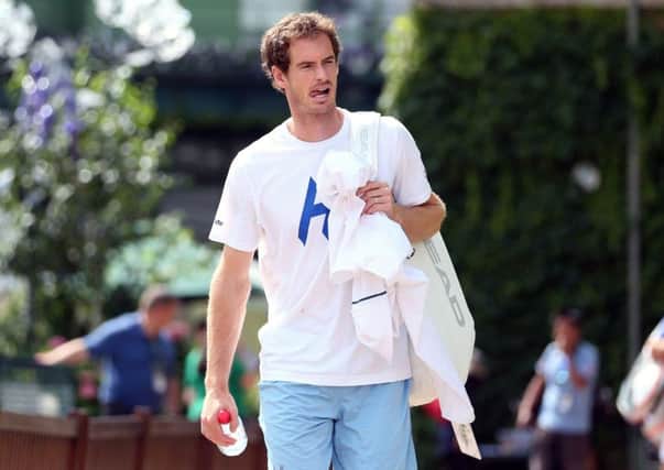 Andy Murray arrives for  training at Wimbledon.
