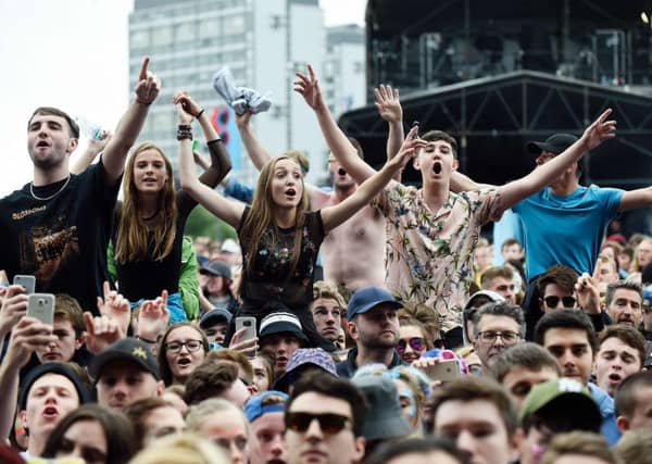 Festival-goers enjoy the music on the third day of TRNSMT on Glasgow Green. Picture: ANDY BUCHANAN/AFP/Getty Images
