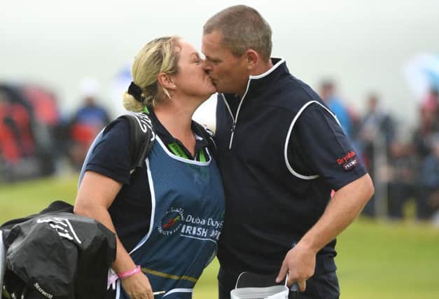David Drysdale shares a kiss with wife/caddie Vicky after his closing 63 at Portstewart. Picture: Getty Images