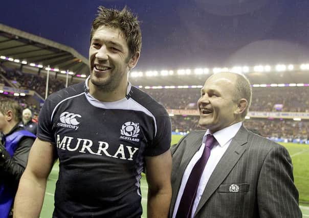 Scotland's Nathan Hines and head coach Andy Robinson celebrate after their 21-17 victory over South Africa at Murrayfield. Picture: GRAHAM STUART/AFP/Getty Images