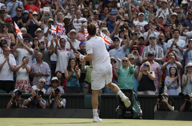 Andy Murray celebrates with fans after beating Benoit Paire. Picture: AP.