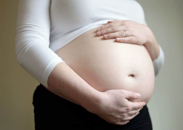 Men can sometimes feel a bit estranged from a woman's pregnancy. Picture: PA