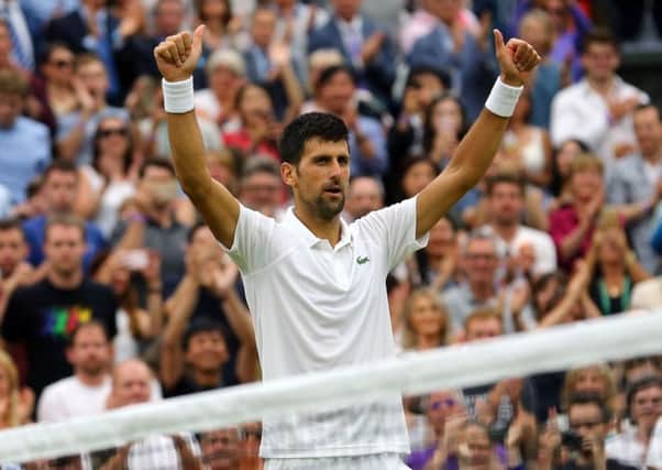 Thumbs-up from Novak Djokovic after his straight-sets defeat of Adrian Mannarino. Picture: PA.