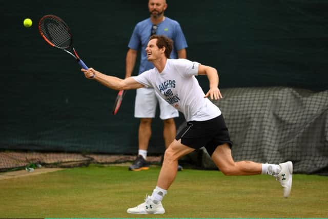 Andy Murray stretches to reach a retun as he practises for his quarter-final against Sam Querrey yesterday. Picture: Getty.