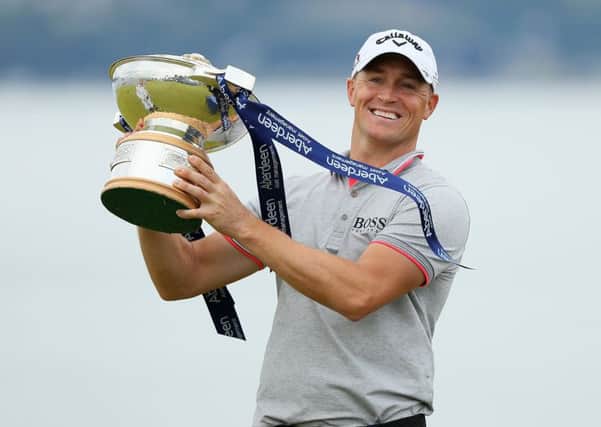 Alex Noren of Sweden poses with the trophy after his victory in last year's AAM Scottish Open at Castle Stuart. Picture: Andrew Redington/Getty Images
