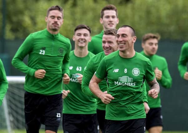 Celtic captain Scott Brown leads the way in training. Picture: Craig Foy/SNS