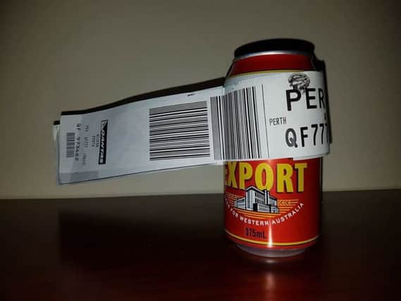 The beer can, complete with luggage tag. Picture: facebook/Dean Stinson