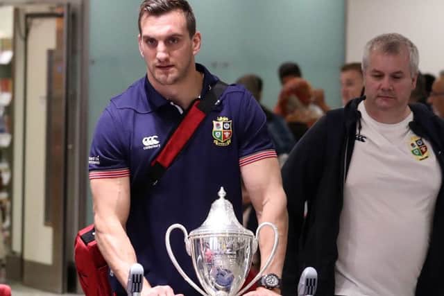 Lions captain Sam Warburton arrives back with the trophy at Heathrow Airport following the series draw with New Zealand. Picture: Steve Parsons/PA Wire