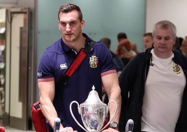 Lions captain Sam Warburton arrives back with the trophy at Heathrow Airport following the series draw with New Zealand. Picture: Steve Parsons/PA Wire