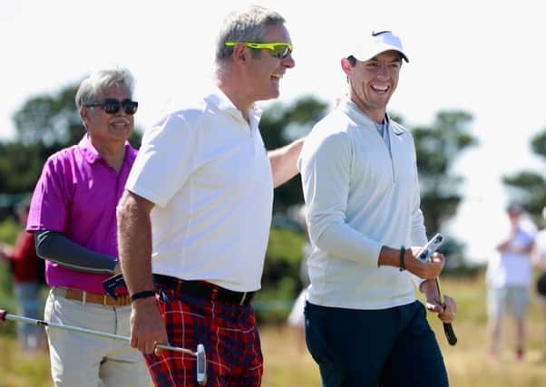 Rory McIlroy shares a joke with Gavin Hastings during the pro-am ahead of the AAM Scottish Open at Dundonald Links.  Picture: Gregory Shamus/Getty Images