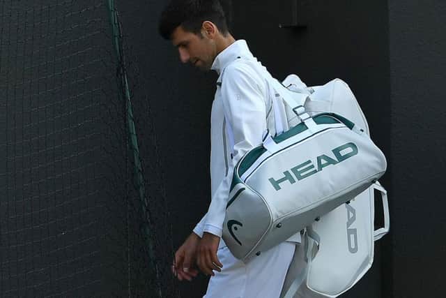 Novak Djokovic leaves the court after retiring from his quarter-final against Tomas Berdych. Picture: Glyn Kirk/AFP/Getty Images