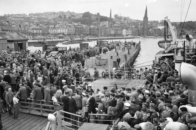 Leaving town became synonymous with the Glasgow Fair. Pictured are crowds of holidaymakers coming ashore at Rothesay pier on July 17, 1956 for the holiday. PIC: TSPL.