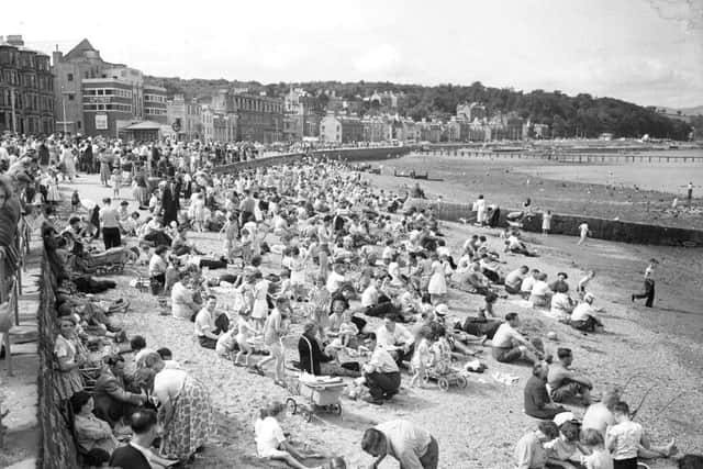 Holidaymakers crowd the beach at Rothesay during the Glasgow Fair in July 1956. PIC: TSPL.