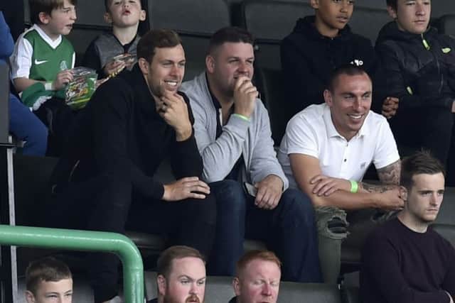 Steven Whittaker, left, was a spectator at Hibs' match against Sunderland on Sunday. He is expected to sign for the Easter Road club next week. Picture: Rob Casey/SNS