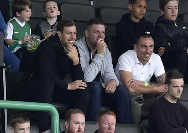 Steven Whittaker, left, was a spectator at Hibs' match against Sunderland on Sunday. He is expected to sign for the Easter Road club next week. Picture: Rob Casey/SNS