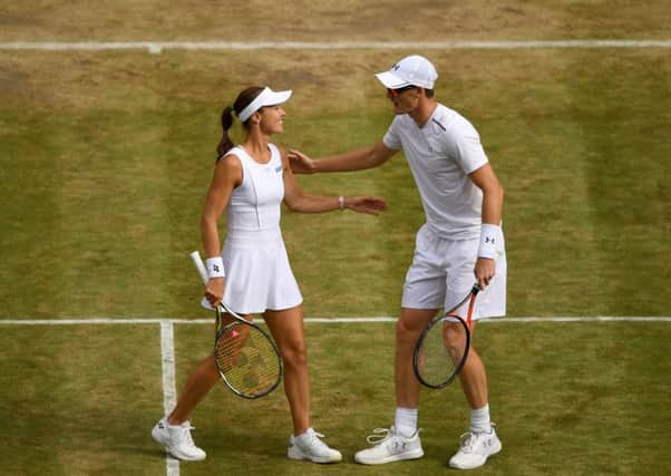 Jamie Murray of Great Britain and Martina Hingis celebrate victory against Ken Skupski and Jocelyn Rae. Picture: Getty.