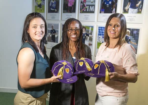 Gemma Fay, Ifeoma Dieke and Julie Fleeting during the opening of a new Scottish FA Women's International Roll of Honour display at Hampden. Picture: Jeff Holmes/PA Wire