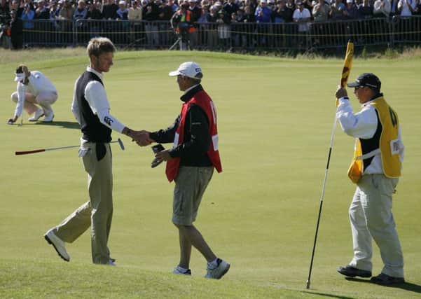 Chris Wood is congratulated by his caddie after completing the fourth round at Royal Birkdale as leading amateur in 2008.  Photograph: Glyn Kirk/Getty Images