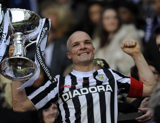 Jim Goodwin lifts the League Cup for St Mirren in 2013. Picture: Phil Wilkinson