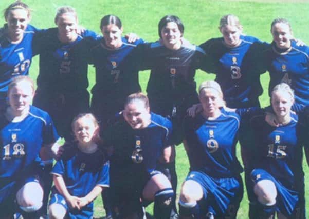 Erin Cuthbert, front row second left, in the Scotland team line-up as a mascot.