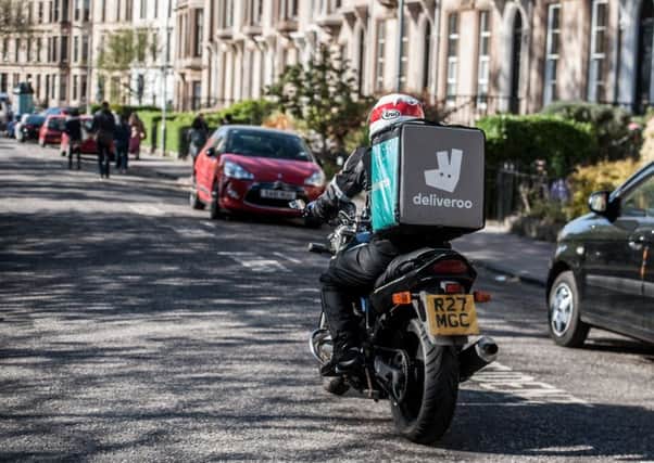 A Deliveroo rider on Byres Road in Glasgow. Picture: John Devlin