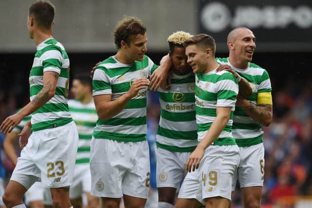 Celtic players celebrate after Scott Sinclair opens the scoring. Picture: Getty