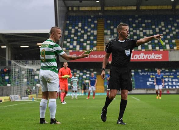 Leigh Griffiths holds the glass bottle thrown in the direction of the striker. Picture: Getty