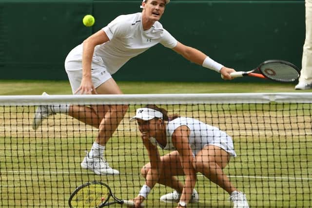 Jamie Murray and Martina Hingis are through to Sunday's mixed doubles final. Picture: Glyn Kirk/AFP/Getty Images