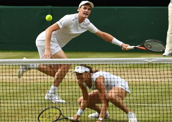 Jamie Murray and Martina Hingis are through to Sunday's mixed doubles final. Picture: Glyn Kirk/AFP/Getty Images