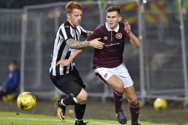 Hearts' Rory Currie skips away from Newcastle's Jack Colback. Picture: Rob Casey/SNS