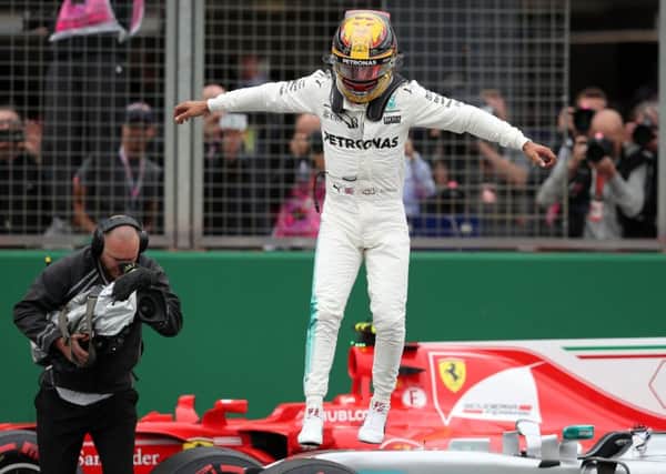 Lewis Hamilton is clearly delighted after leaving the field trailing in final qualifying.  Photograph: David Davies/PA