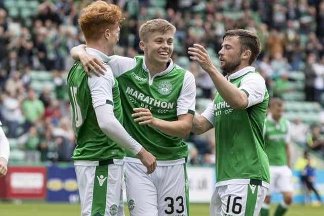 Hibernian's Simon Murray celebrates scoring the opening goal with Fraser Murray and Lewis Stevenson. Picture: SNS/Alan Rennie
