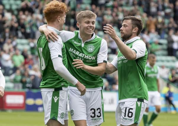 Hibernian's Simon Murray celebrates scoring the opening goal with Fraser Murray and Lewis Stevenson. Picture: SNS/Alan Rennie