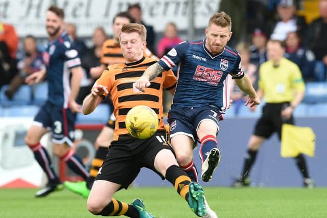 Alloa's Alan Cook and Ross County's Michael Gardyne tussle. Picture: SNS/Craig Foy