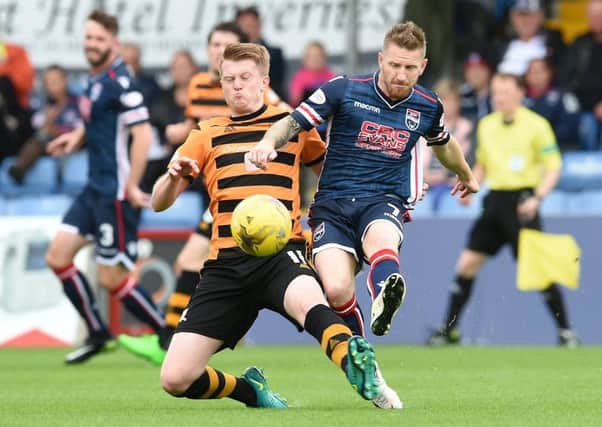 Alloa's Alan Cook and Ross County's Michael Gardyne tussle. Picture: SNS/Craig Foy