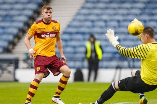 Chris Cadden finishes off a fine move to put Motherwell ahead. Picture: SNS/Roddy Scott
