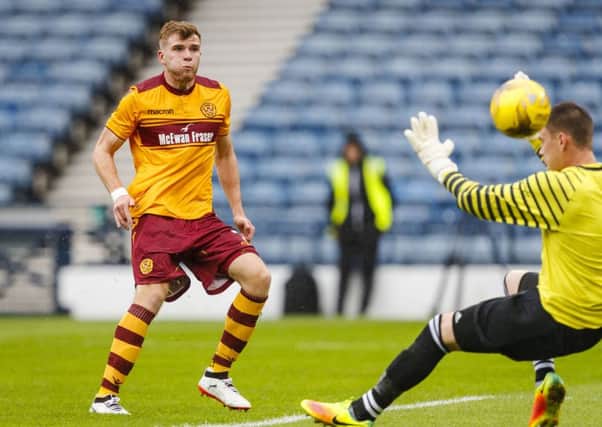 Chris Cadden finishes off a fine move to put Motherwell ahead. Picture: SNS/Roddy Scott