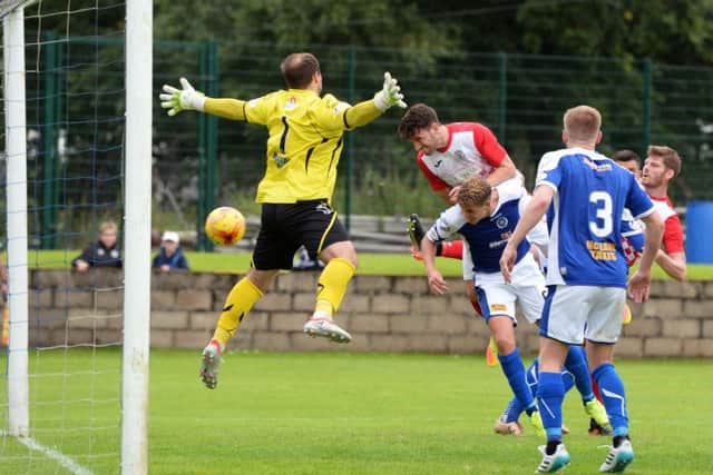 St Mirren's Gregor Buchanan heads into the net. Picture: SNS/Ross Parker