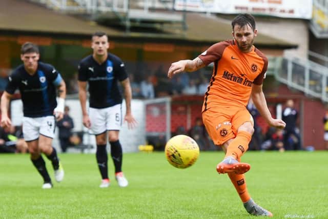 James Keatings sweeps home the 72nd-minute penalty for Dundee United after substitute Sam Stanton had been brought down.  Photograph: Sammy Turner/SNS