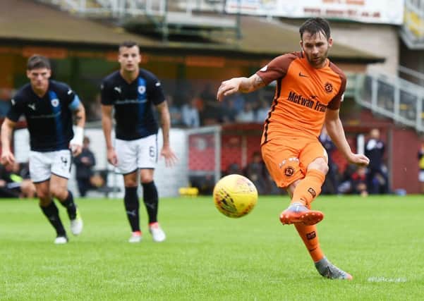 James Keatings sweeps home the 72nd-minute penalty for Dundee United after substitute Sam Stanton had been brought down. Photograph: Sammy Turner/SNS