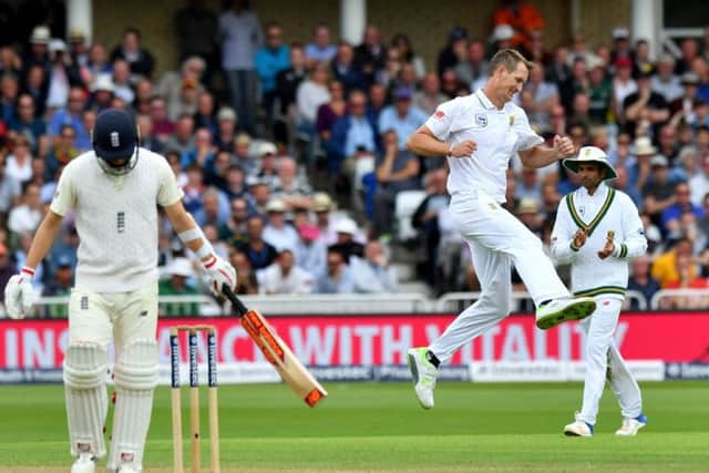 South Africas Chris Morris celebrates taking the wicket of Englands Mark Wood.  Photograph: Anthony Devlin/Getty Images