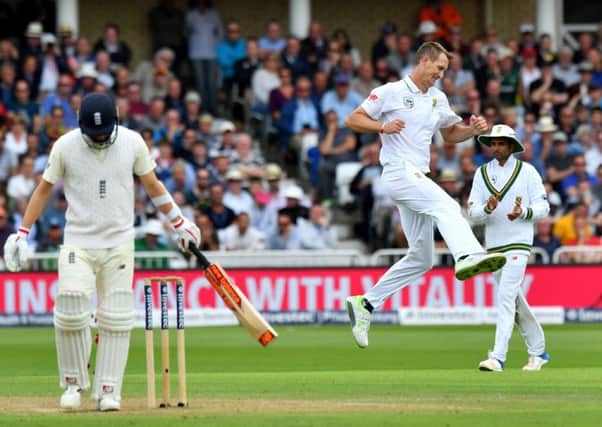 South Africas Chris Morris celebrates taking the wicket of Englands Mark Wood.  Photograph: Anthony Devlin/Getty Images