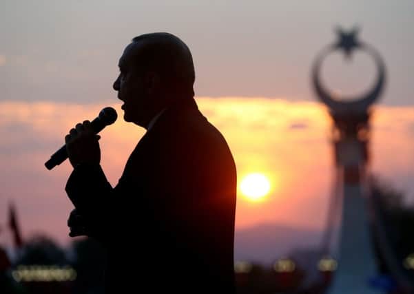 Turkey's President Recep Tayyip Erdogan delivers a speech to crowds outside the Presidential Palace. Picture: AP